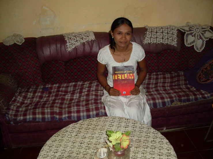 a woman is sitting at a table with some food