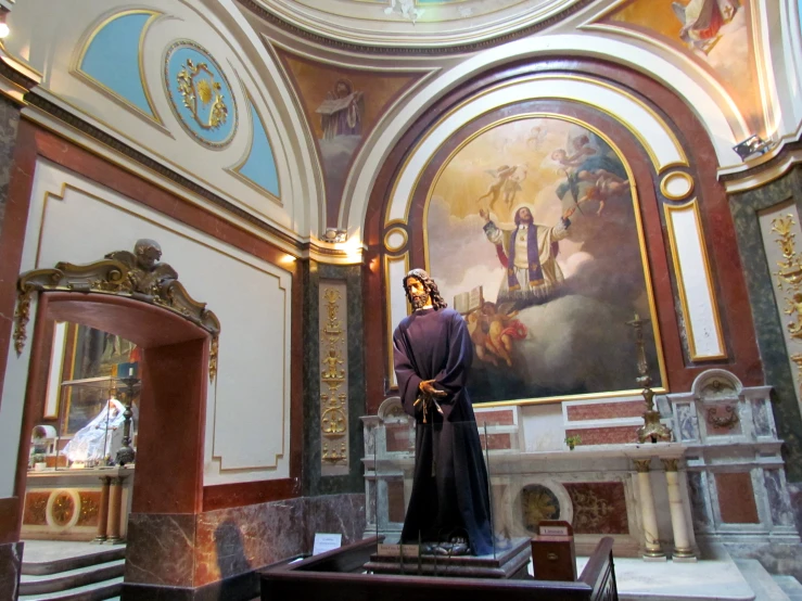 statues and paintings in the interior of a building