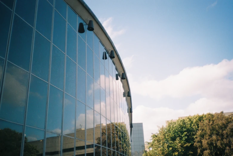 a reflection of some buildings in a building windows