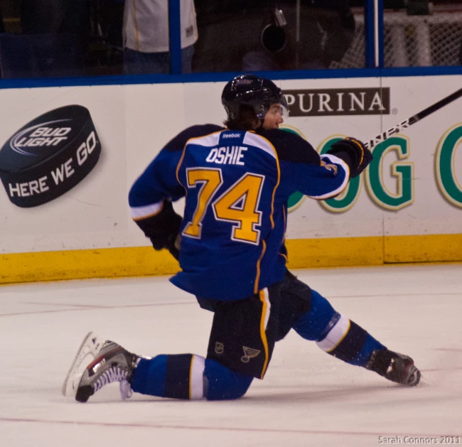 there is a hockey player running in the ice