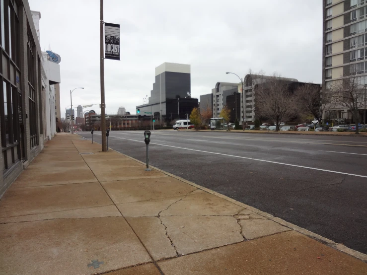 a long sidewalk beside the road is shown