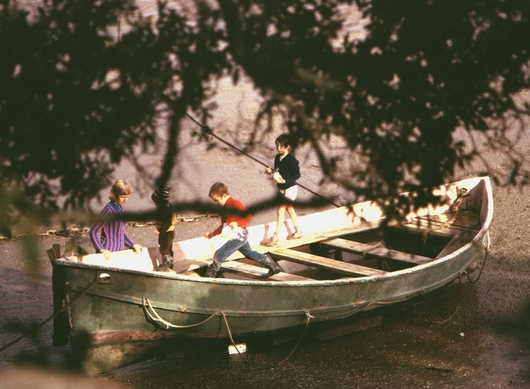 four s are sitting in a boat that is on the water