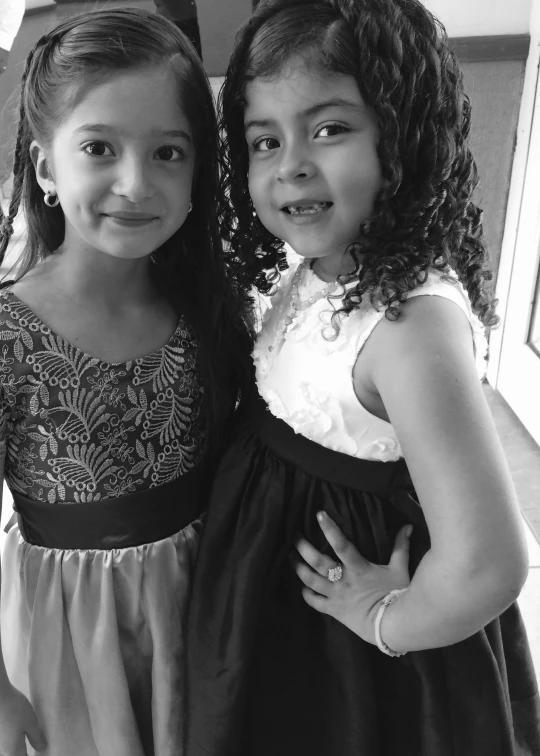 two s pose together in black and white