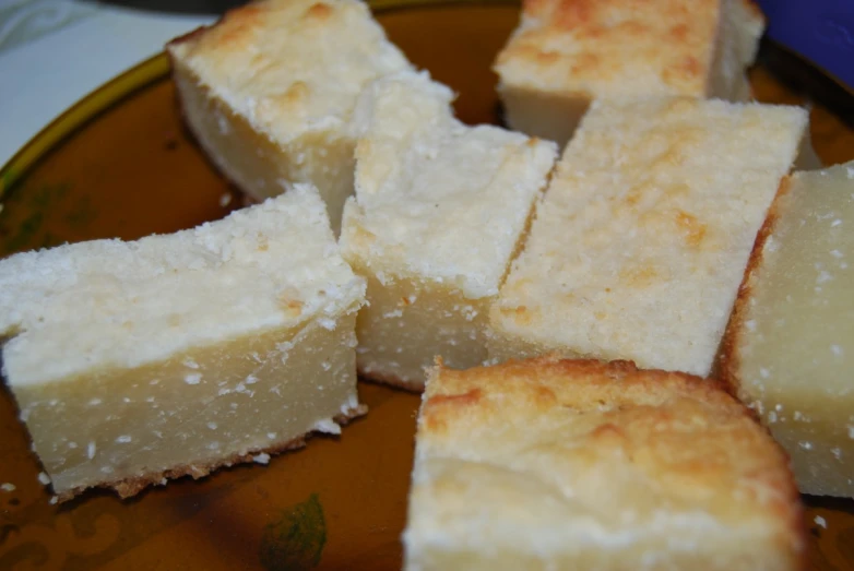 food sitting on a plate with white bread