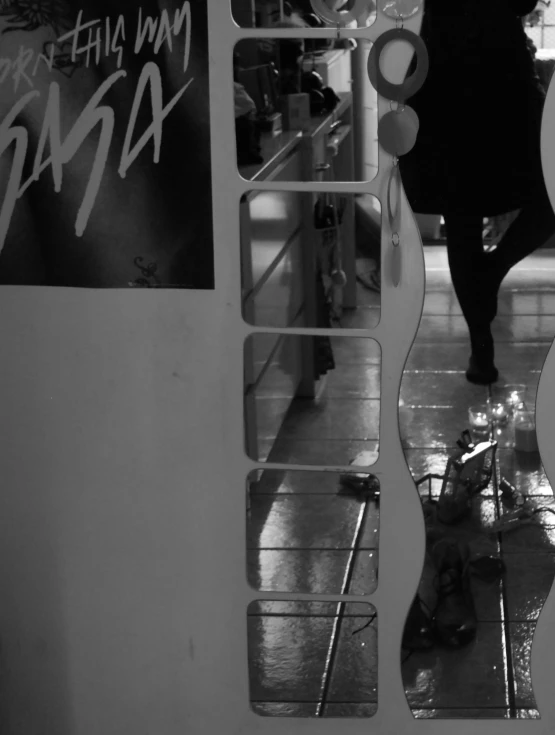 a woman walks out of a store with her legs up