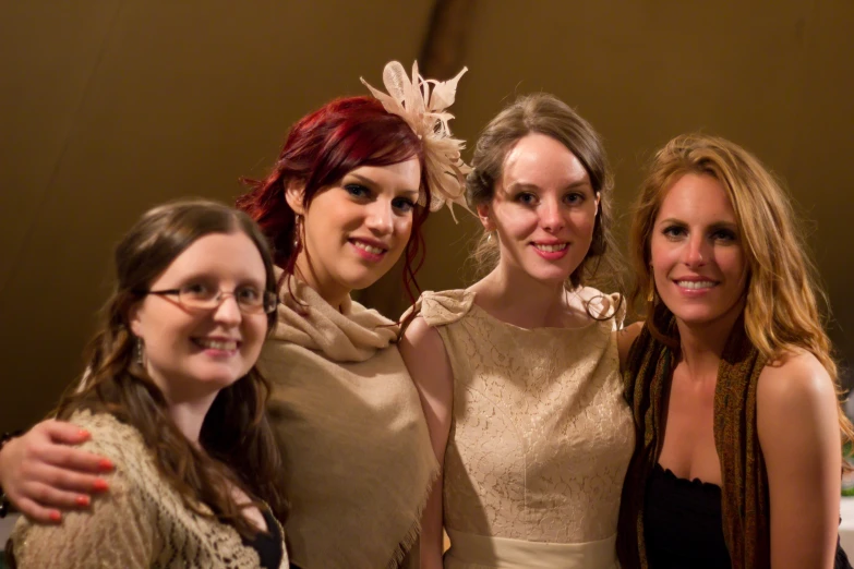 three women standing together and taking a po