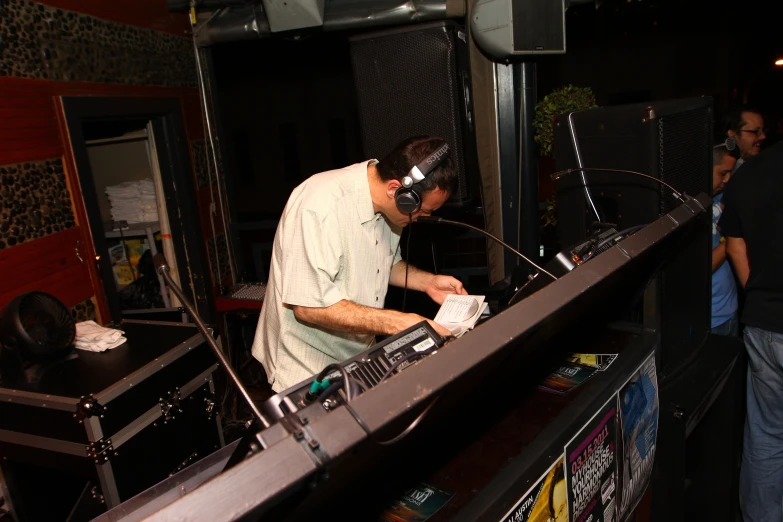 a dj mixes up his music at a party