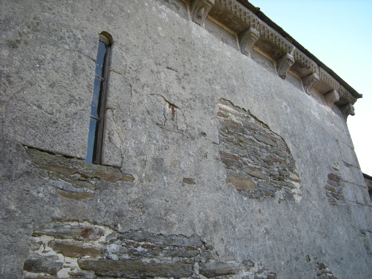 the old building is made of grey concrete