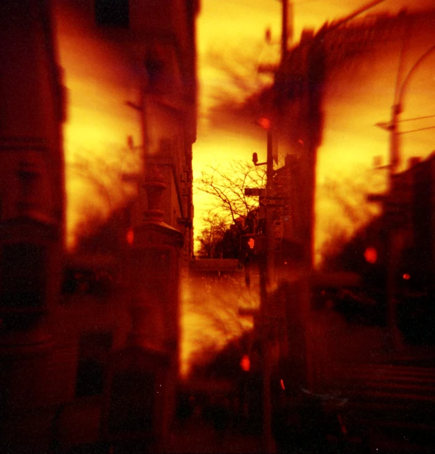 a view of the street through windows in a building