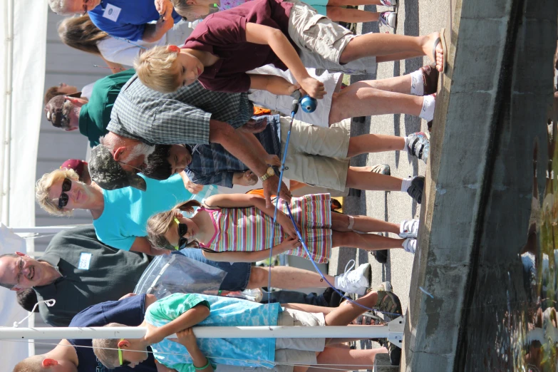 the man teaching a little boy how to stand up