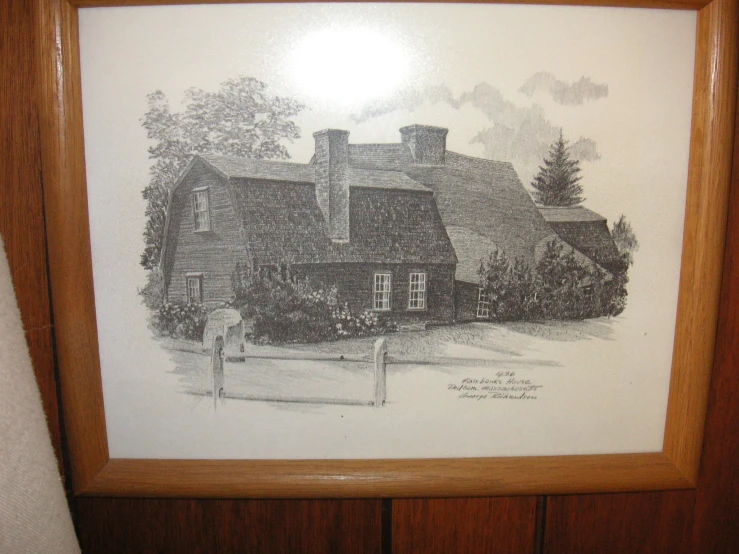 a drawing on paper of a house and trees