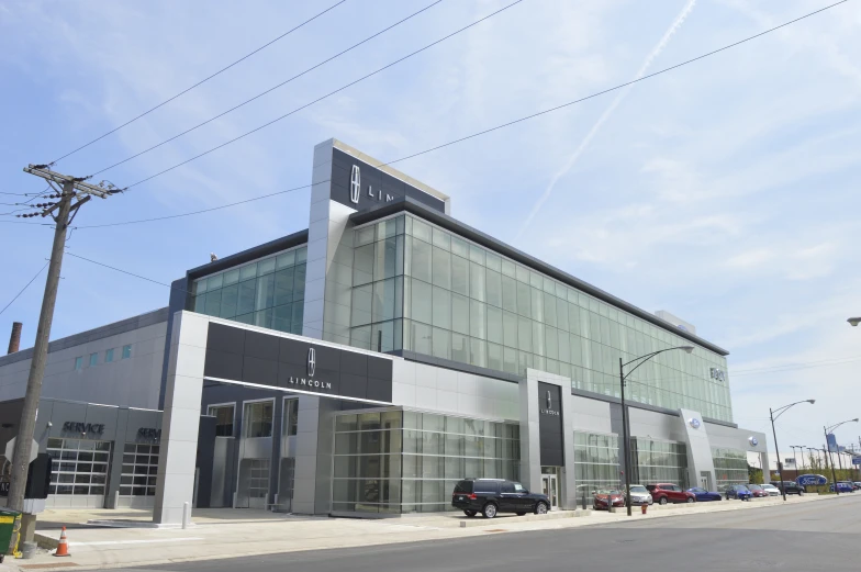 the front of an auto dealership next to the street