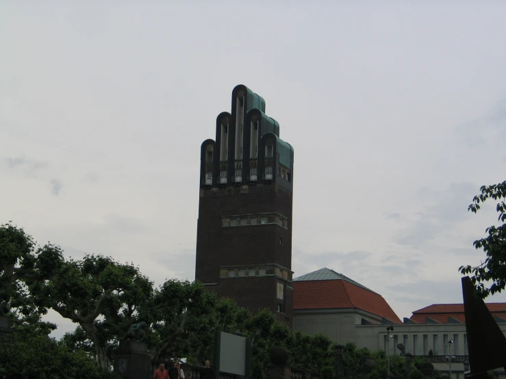 a clock tower with a glass facade at the top