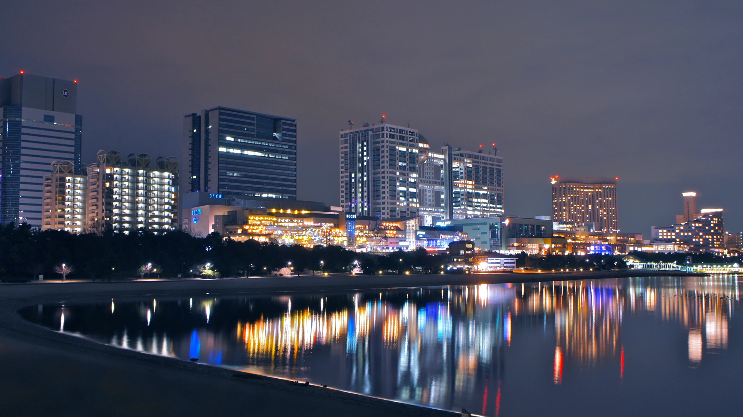 the city is illuminated in a dim lit up sky