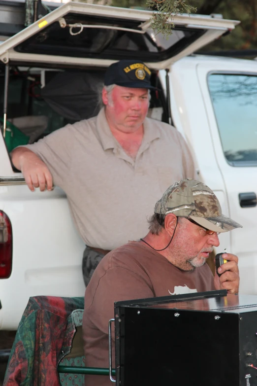 a man with a hat is smoking a cigarette