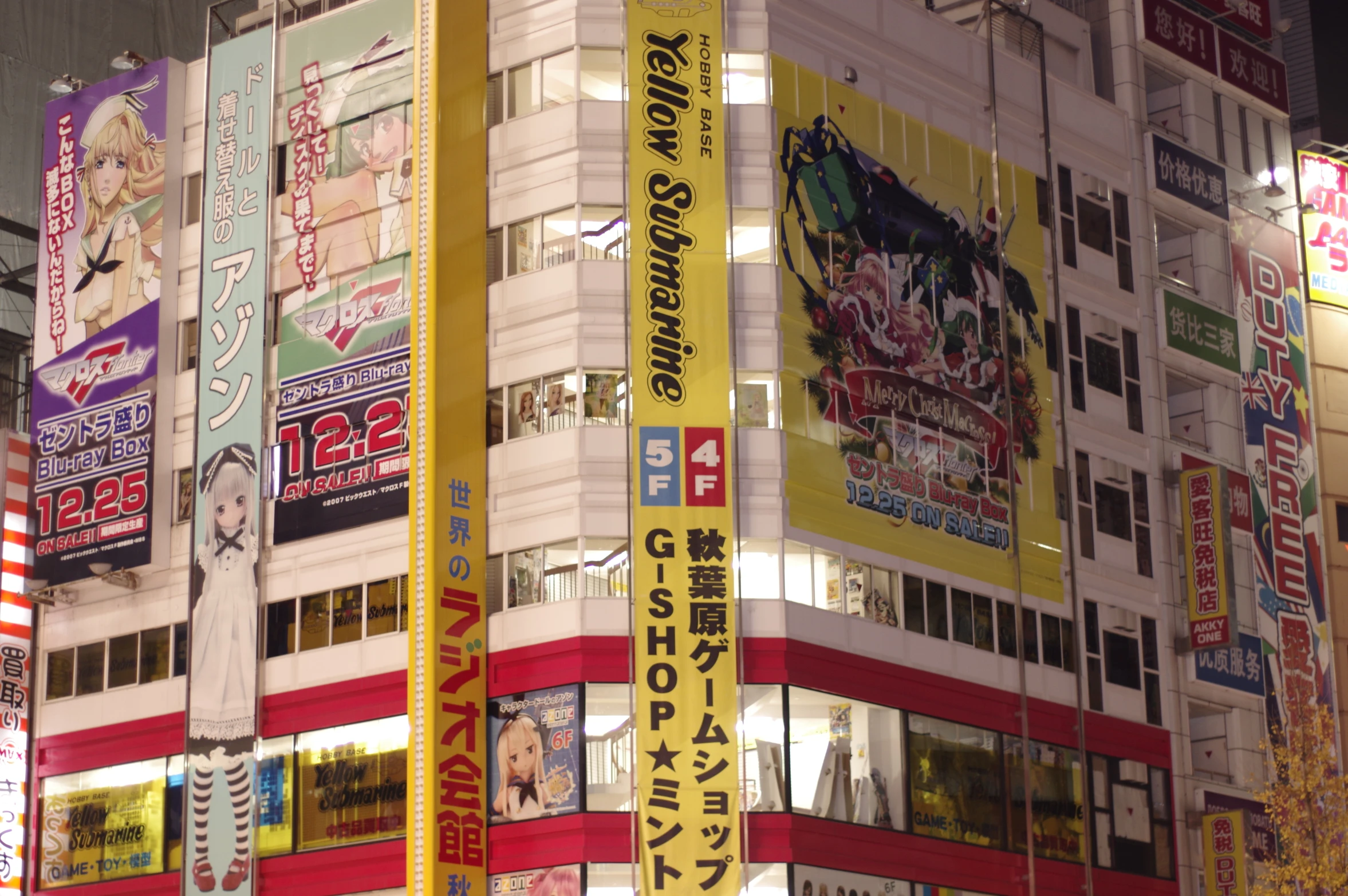 several multicolored advertits adorn the buildings of a tokyo city