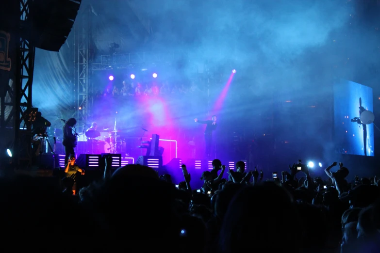 the stage is full of colorful lights and people