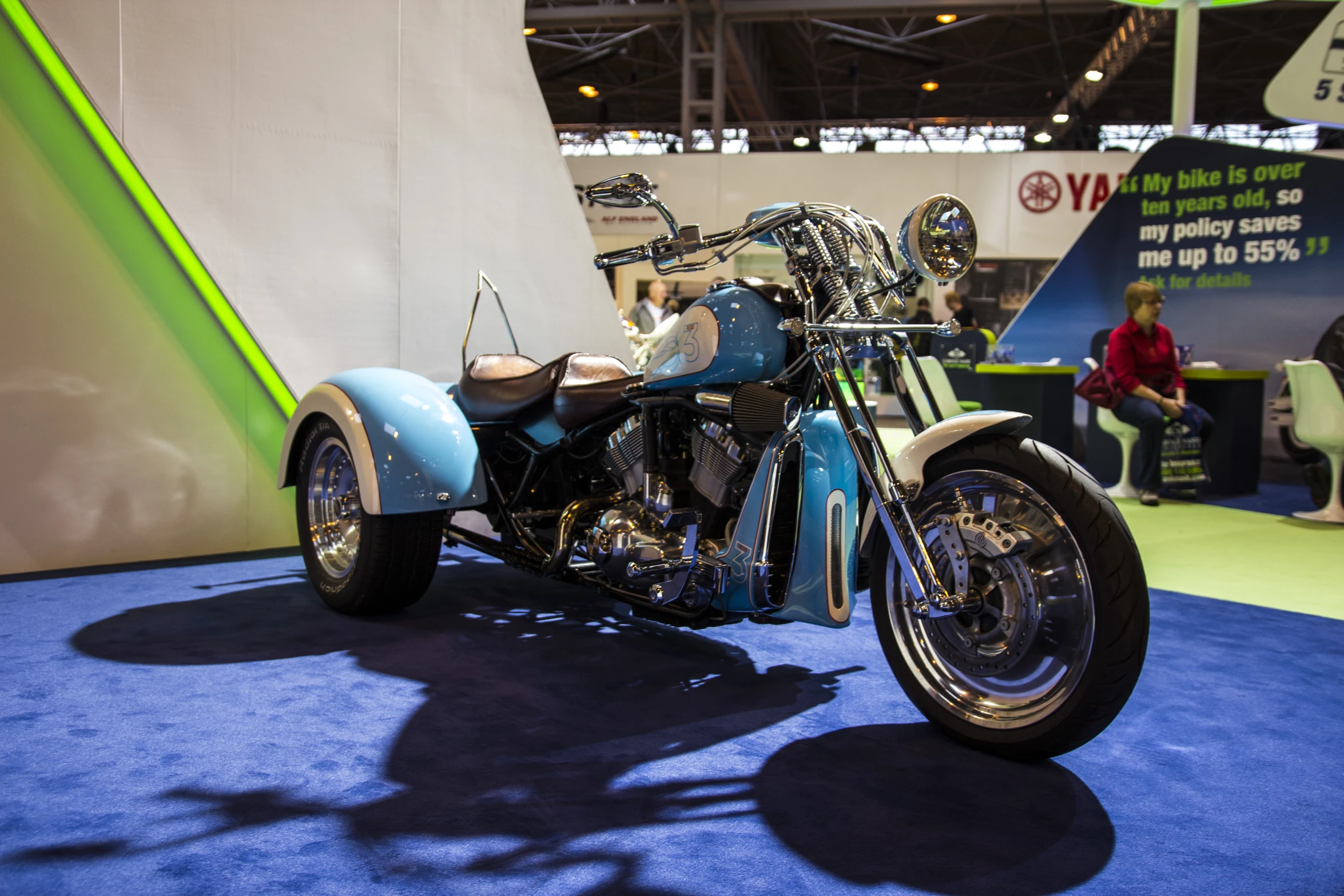 a close up of a motorcycle on display at a convention