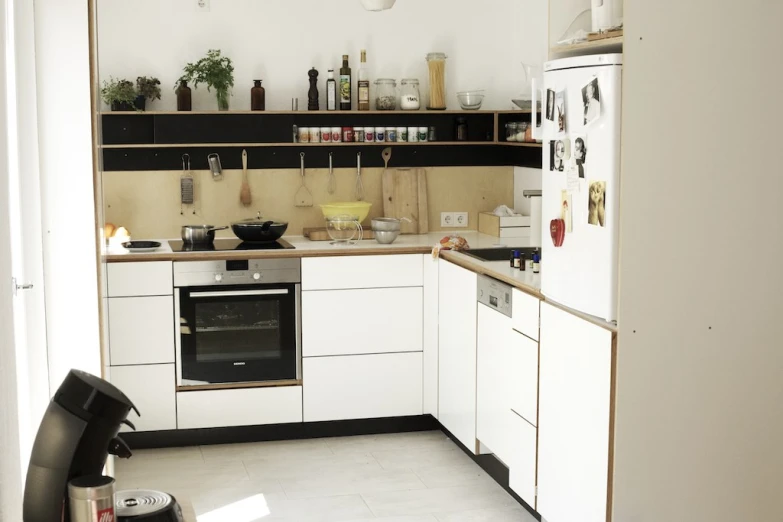 an empty kitchen with a stove top oven