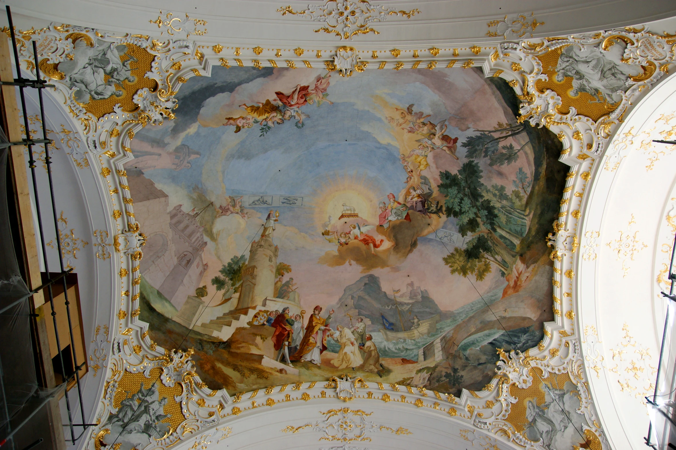 a painted ceiling and a small clock