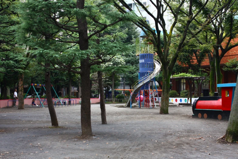 a children's playground with many slides and swings