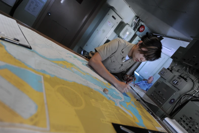 the woman is looking at a map on the table