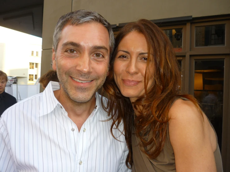 a man and woman posing for the camera