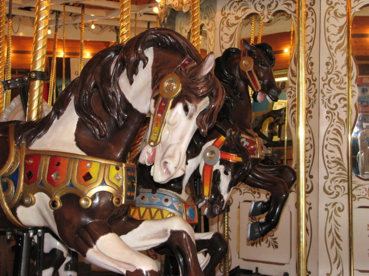 large horses riding in an amut center at night