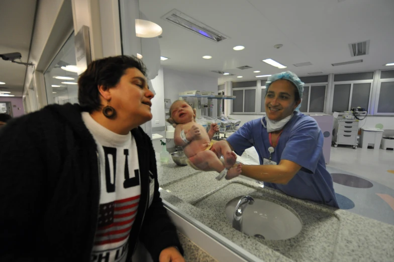 a woman and child in a hospital getting their medicine s