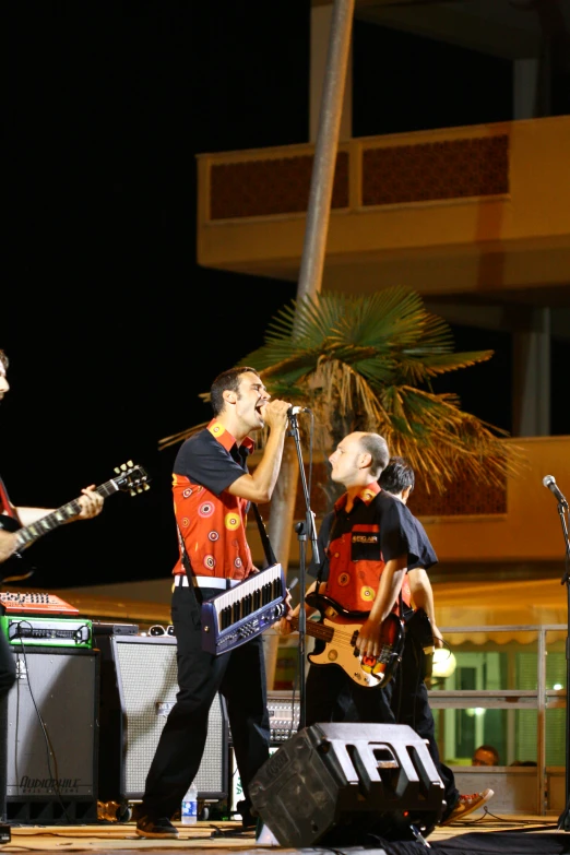 two men playing music together on stage