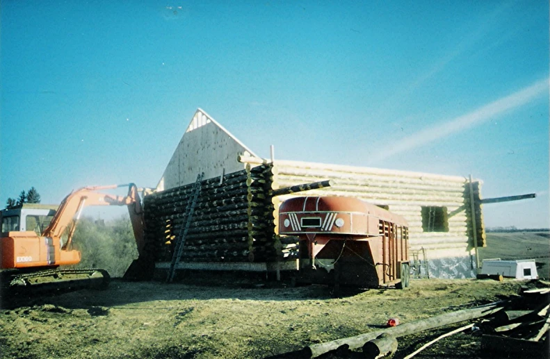 a dump truck hauling a large pile of wood