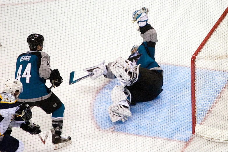 two hockey players are in action on the ice