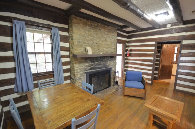 a living room filled with furniture next to a fireplace