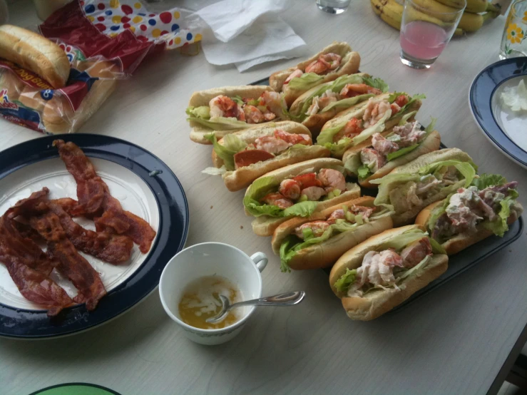 a table topped with many different kinds of sandwiches