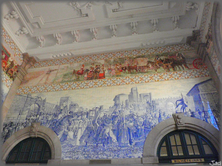 a large mural in the ceiling of a building