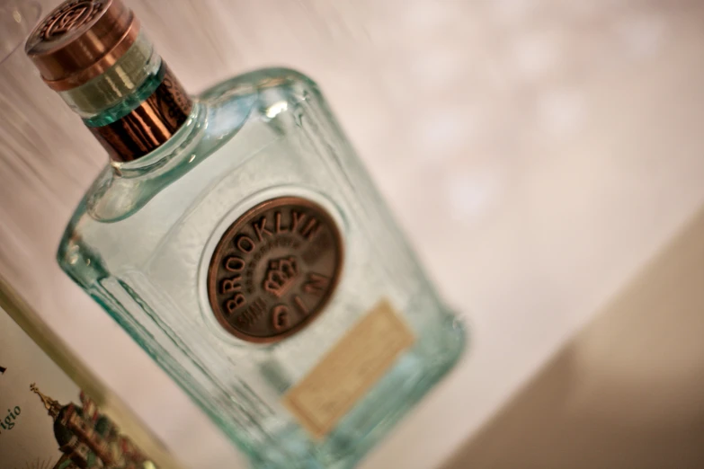 a bottle of gin on the counter in a bathroom