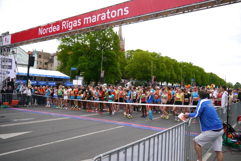 a crowd of people is watching a marathon