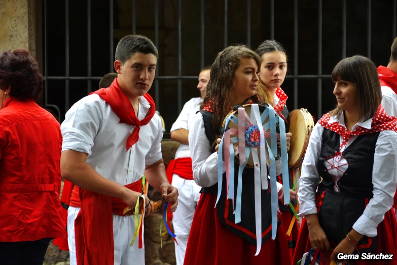 a group of children are standing outside together