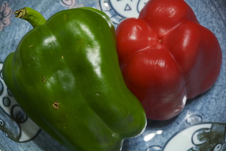 two large and one small green peppers