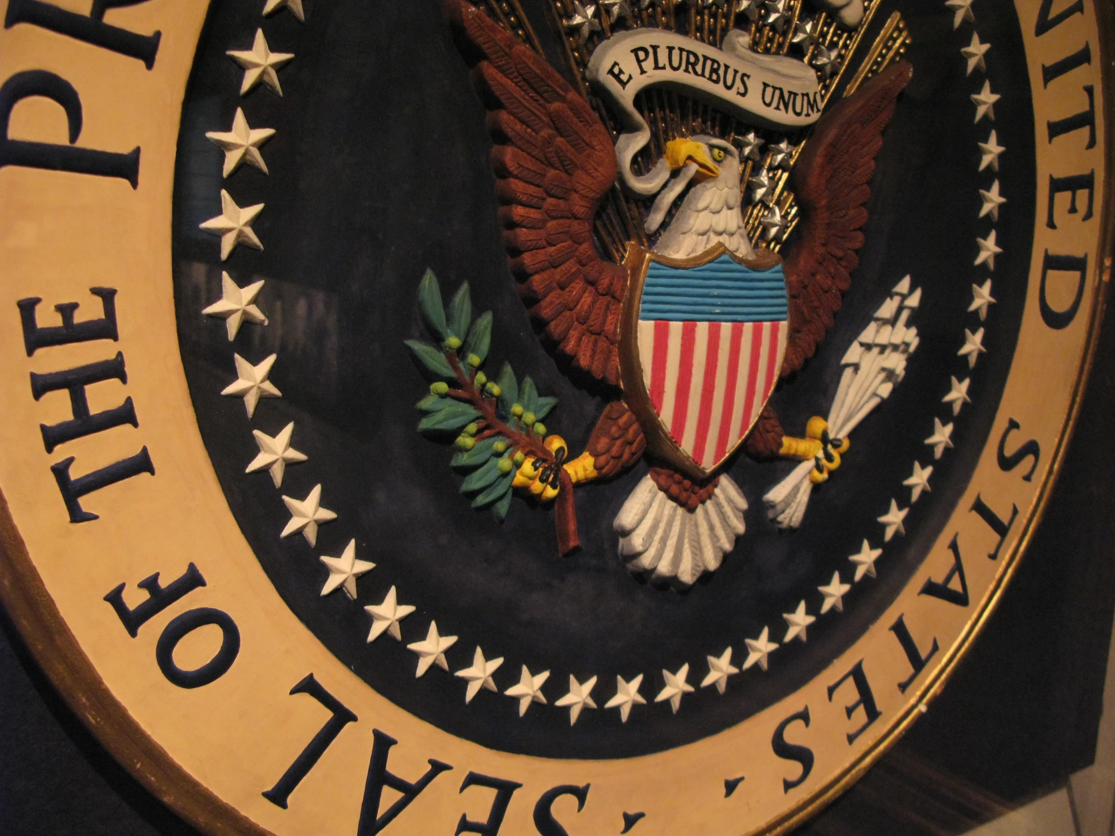 the department of justice logo on the wall in a building