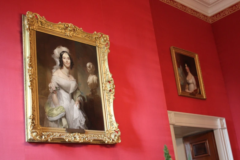 a painting of lady in white is on the wall