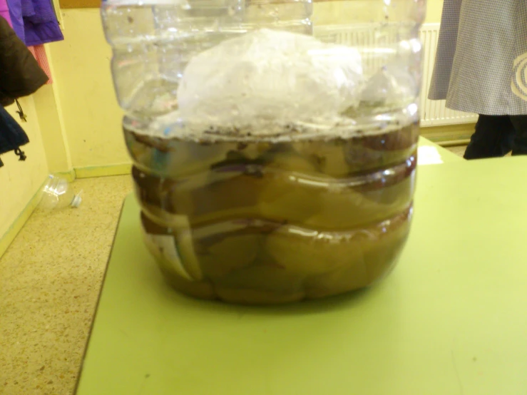a large jar filled with jelly and ice