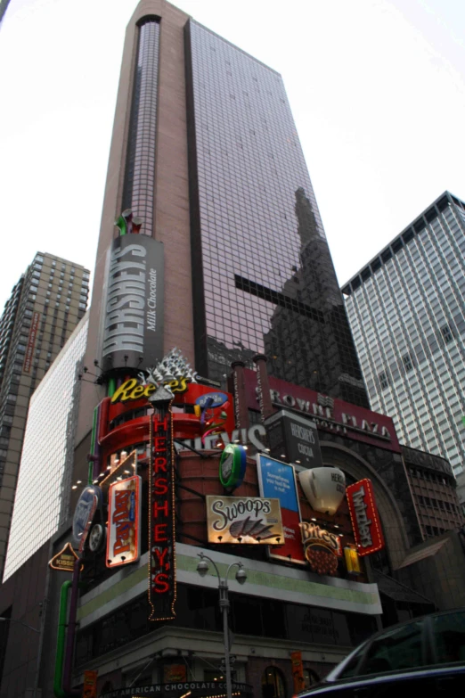 the new york city buildings are covered in bright signs