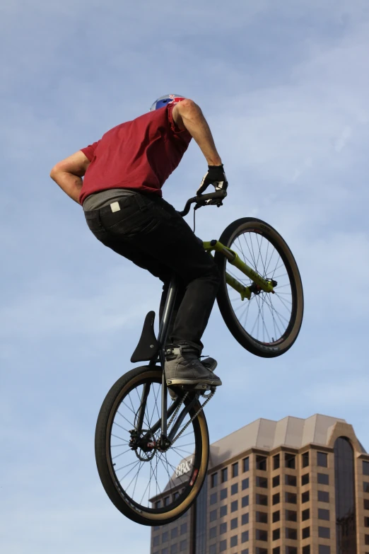 a person doing a trick on a bike in mid air