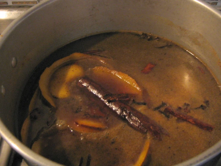 a pan on the stove that has food inside