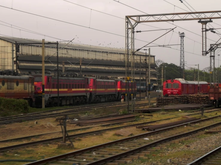 a group of trains that are parked on the tracks