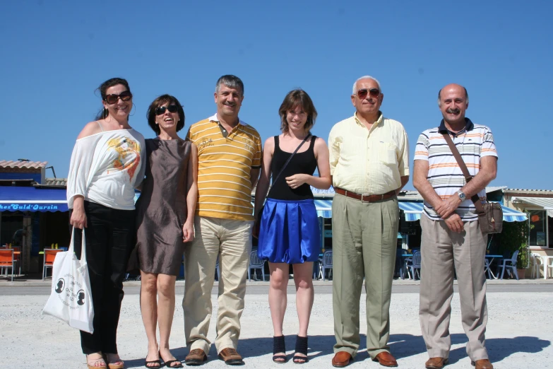 a group of four smiling people pose together