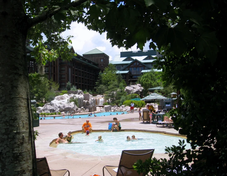 people in an open area next to a building