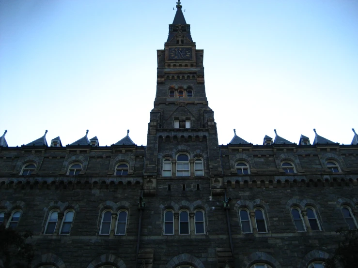 there is a very tall clock tower on the side of the building