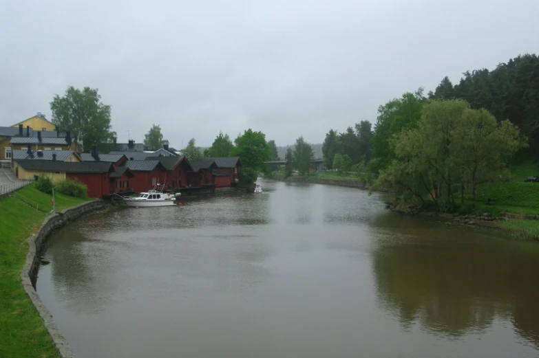 a long canal runs between two red homes